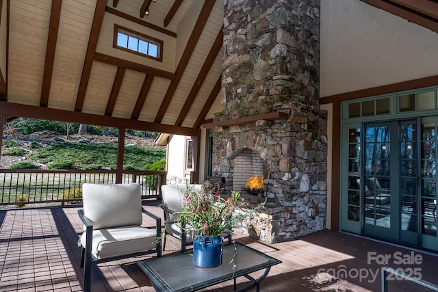 wooden terrace featuring a fireplace