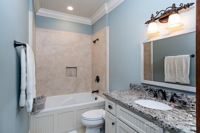 bathroom with crown molding, bathing tub / shower combination, toilet, and vanity