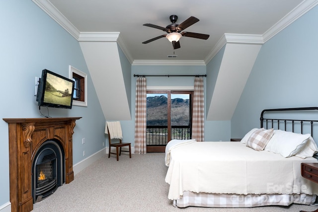 bedroom featuring a warm lit fireplace, baseboards, access to outside, carpet, and crown molding