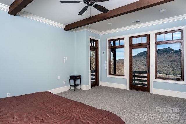 unfurnished bedroom with carpet floors, visible vents, a mountain view, access to outside, and beamed ceiling