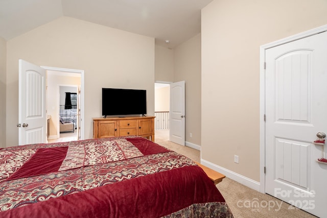 bedroom featuring baseboards, light colored carpet, and high vaulted ceiling