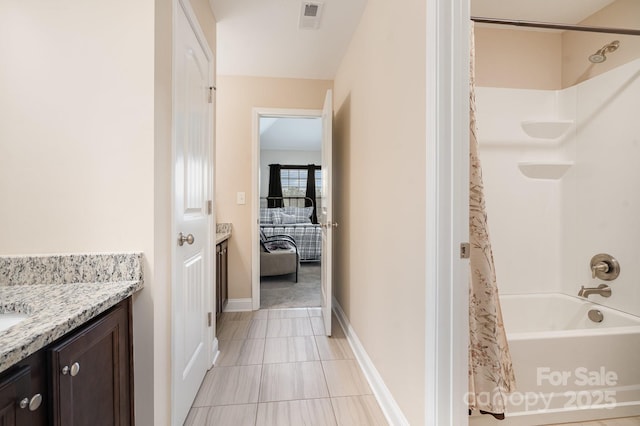 bathroom featuring visible vents, baseboards, vanity, and shower / bath combination with curtain