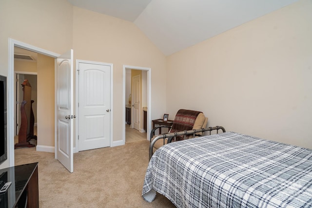 bedroom featuring light carpet, baseboards, and lofted ceiling