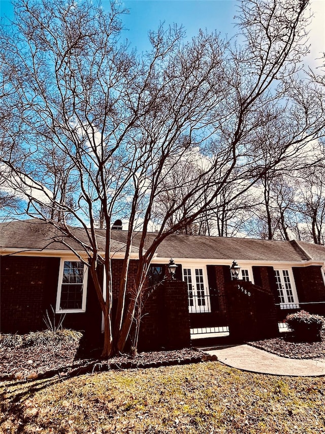 view of side of property with french doors