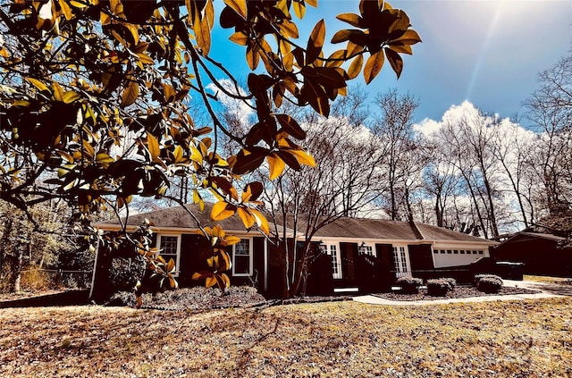 single story home with a garage