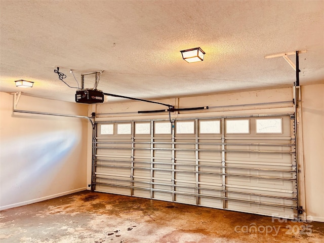 garage featuring baseboards and a garage door opener