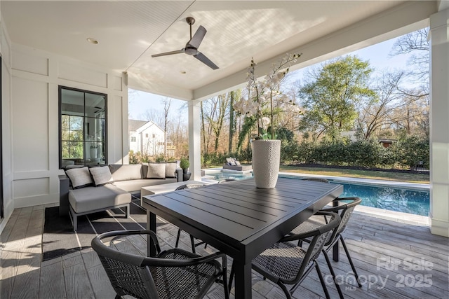 wooden deck with an outdoor pool, an outdoor hangout area, a patio, and a ceiling fan