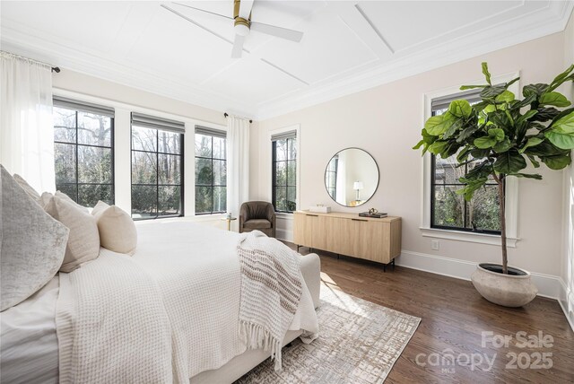 bedroom with ceiling fan, baseboards, dark wood-style flooring, and ornamental molding