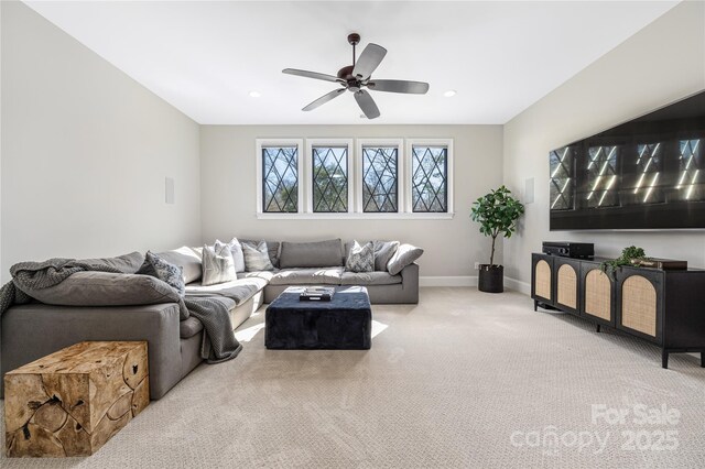 carpeted living room featuring recessed lighting, baseboards, and a ceiling fan