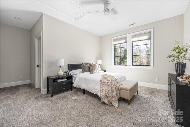 bedroom featuring visible vents, baseboards, light colored carpet, attic access, and ceiling fan