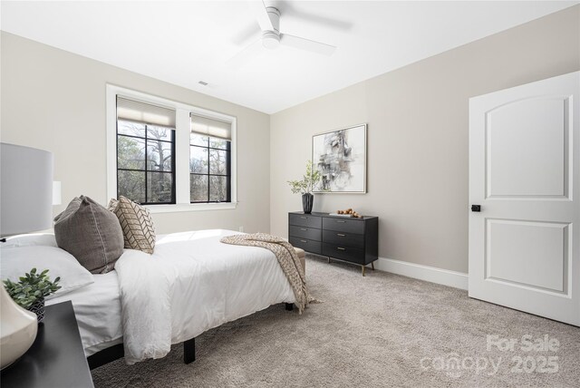 bedroom featuring visible vents, baseboards, carpet, and ceiling fan