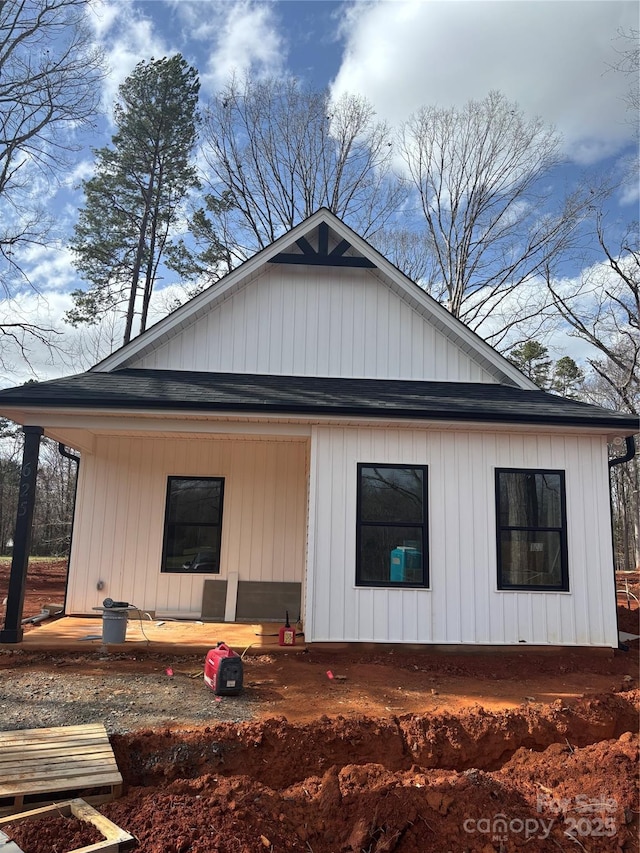 view of property exterior with a porch