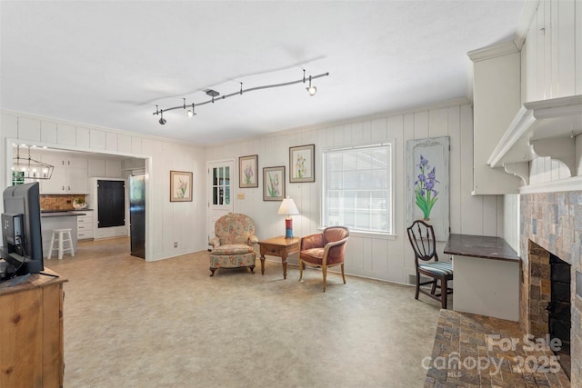 living area featuring visible vents and a fireplace