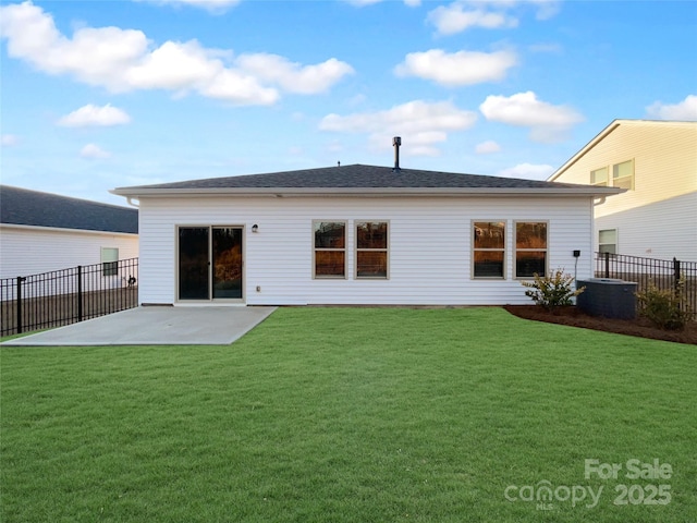 back of house with a yard, a patio area, fence, and central AC