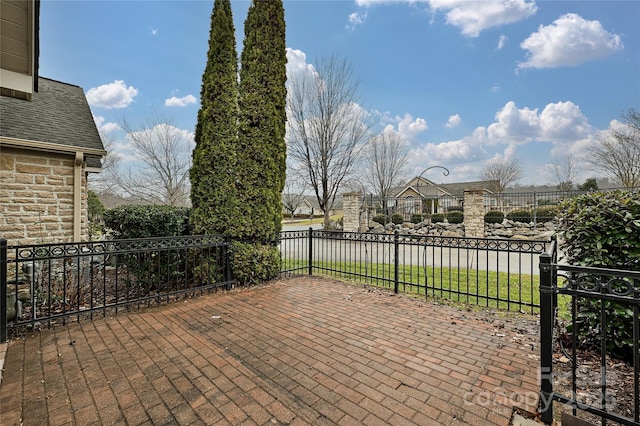 view of patio featuring fence