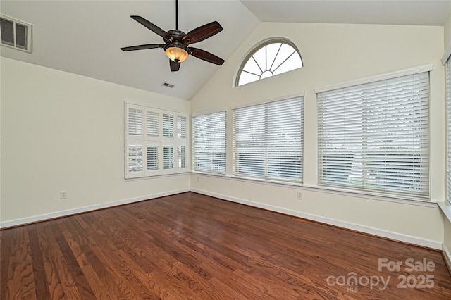 unfurnished room featuring vaulted ceiling, visible vents, dark wood finished floors, and a ceiling fan