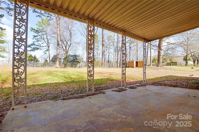 view of patio / terrace with a fenced backyard and an outdoor structure