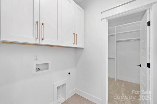 laundry area featuring hookup for an electric dryer, carpet floors, washer hookup, baseboards, and cabinet space