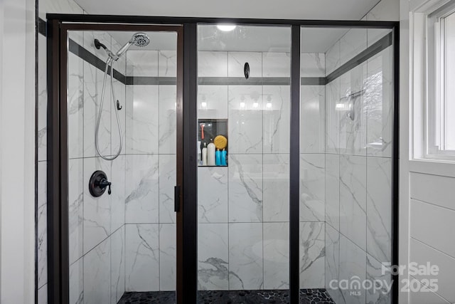 bathroom with a shower stall