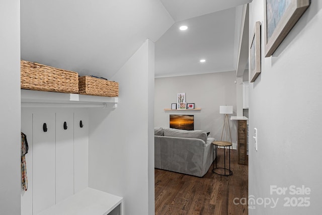 mudroom featuring recessed lighting, a fireplace, and wood finished floors