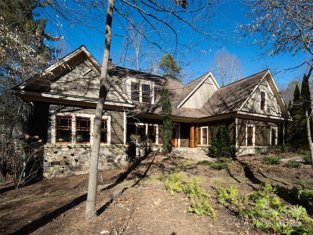 view of front of home with roof with shingles