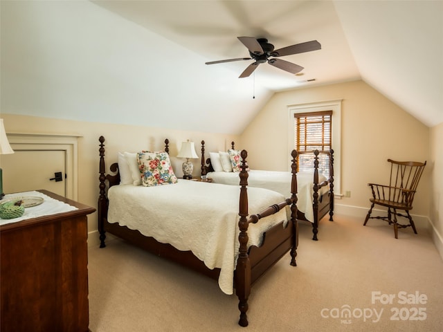 bedroom featuring light carpet, baseboards, visible vents, lofted ceiling, and ceiling fan