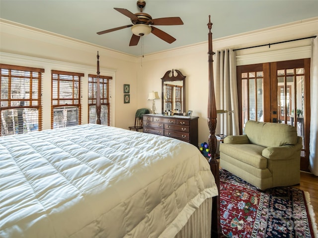 bedroom featuring ornamental molding, french doors, ceiling fan, and wood finished floors