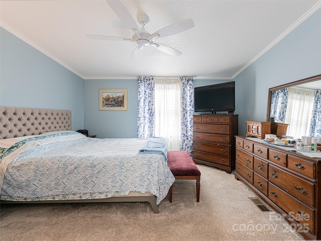 bedroom featuring ornamental molding, multiple windows, visible vents, and light carpet