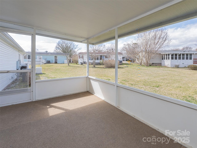 unfurnished sunroom featuring a residential view