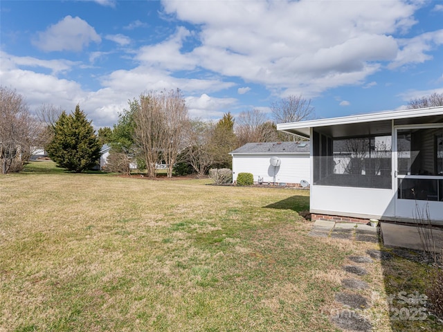 view of yard with a sunroom