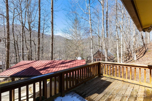 wooden deck featuring a wooded view