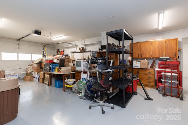 garage with a workshop area and a garage door opener