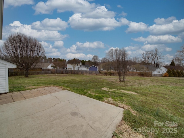 view of yard featuring a patio area and fence