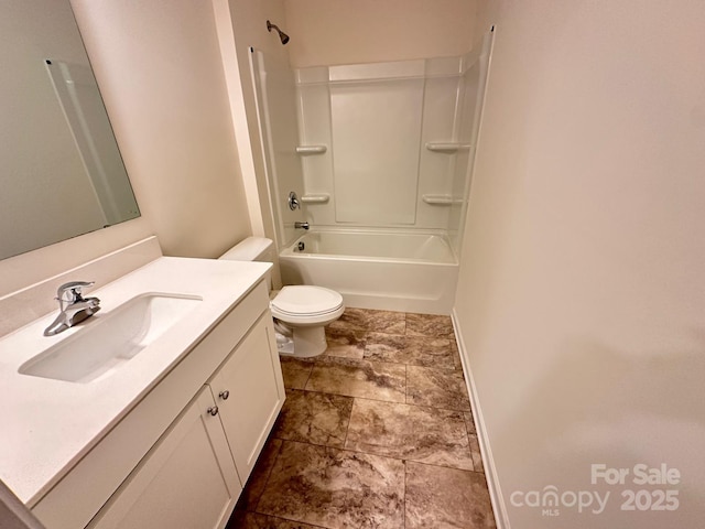 full bathroom with washtub / shower combination, vanity, toilet, and baseboards