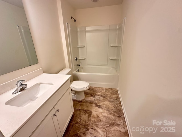 full bath with shower / bath combination, vanity, toilet, and baseboards