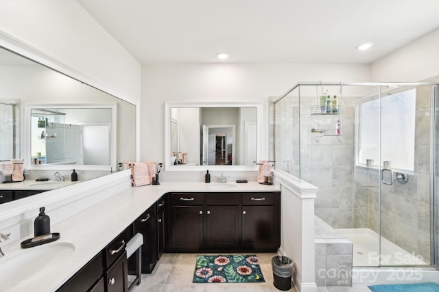 bathroom featuring a sink and a stall shower