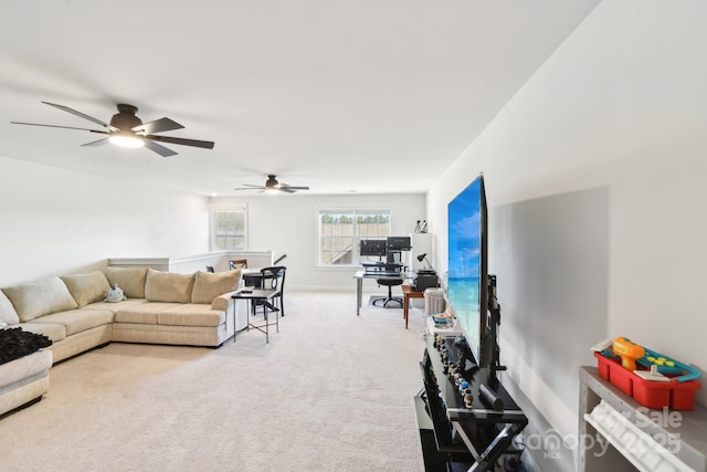 carpeted living area featuring baseboards