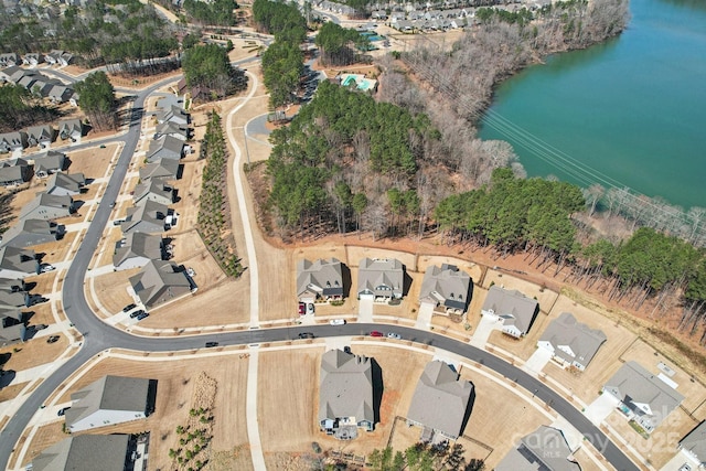 birds eye view of property with a residential view and a water view