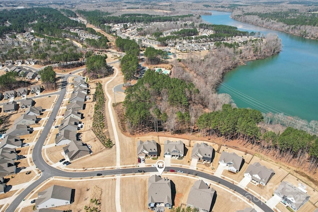 aerial view with a residential view and a water view