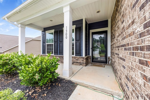1300 Dali Blvd, Mount Holly, NC 28120 - view of exterior entry with brick siding and a porch