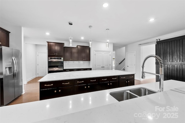 1300 Dali Blvd, Mount Holly, NC 28120 - kitchen with stainless steel refrigerator with ice dispenser, a sink, recessed lighting, backsplash, and a kitchen island