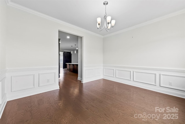 1300 Dali Blvd, Mount Holly, NC 28120 - unfurnished room with a chandelier, crown molding, wood finished floors, and wainscoting