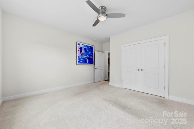 1300 Dali Blvd, Mount Holly, NC 28120 - unfurnished bedroom with carpet floors, baseboards, a closet, and a ceiling fan