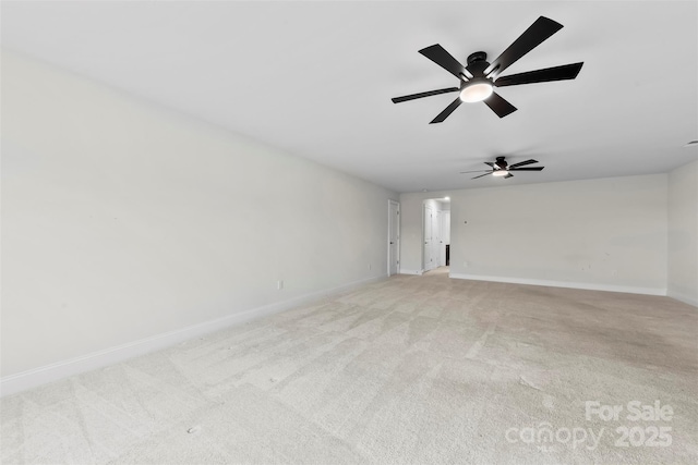 1300 Dali Blvd, Mount Holly, NC 28120 - unfurnished living room featuring baseboards, light colored carpet, and a ceiling fan