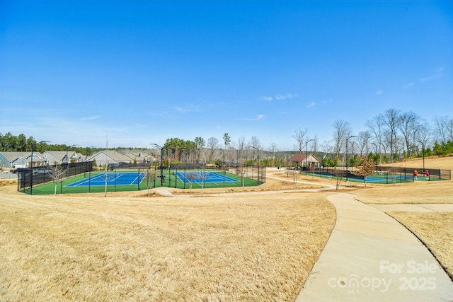 1300 Dali Blvd, Mount Holly, NC 28120 - view of property's community featuring a tennis court and fence