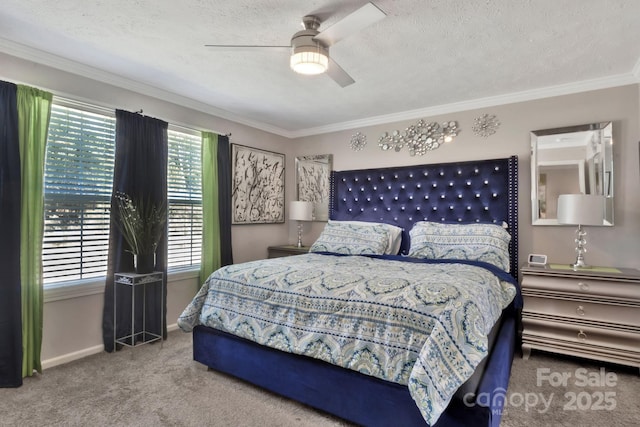 bedroom with carpet flooring, crown molding, a textured ceiling, and baseboards