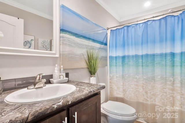 full bathroom featuring ornamental molding, vanity, toilet, and shower / bath combo with shower curtain