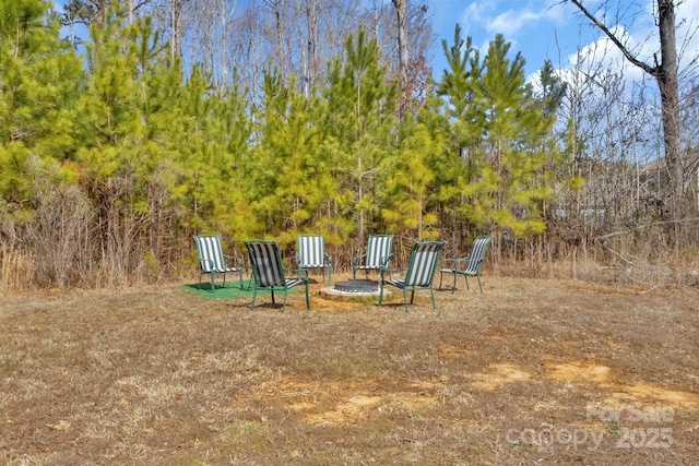 view of play area with a fire pit