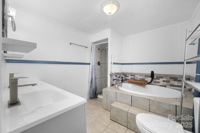 full bath featuring tile patterned floors, a garden tub, toilet, a stall shower, and a sink