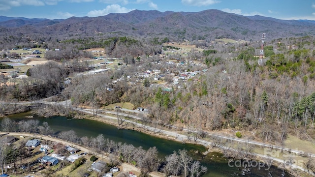 aerial view featuring a water and mountain view